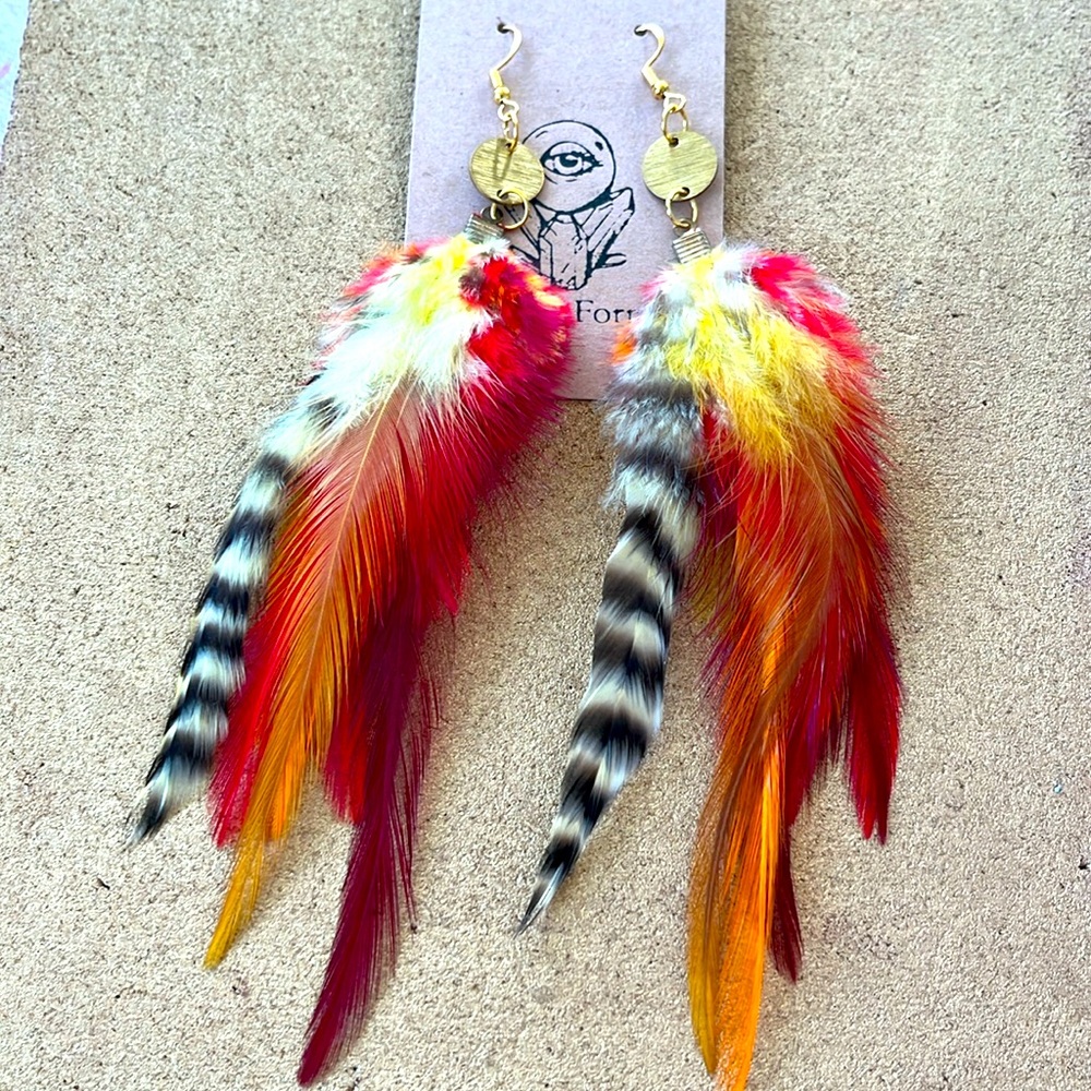 Long orange, red and yellow feathers earrings with circle gold pendants